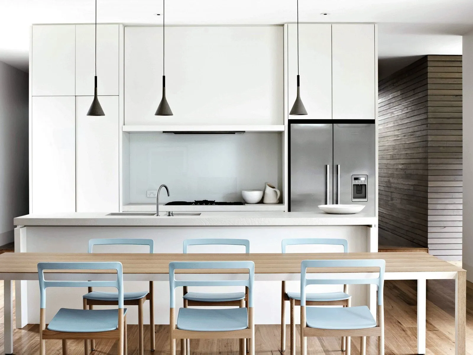 Transitional white kitchen with pendant lighting from the Vamaylo Haven collection